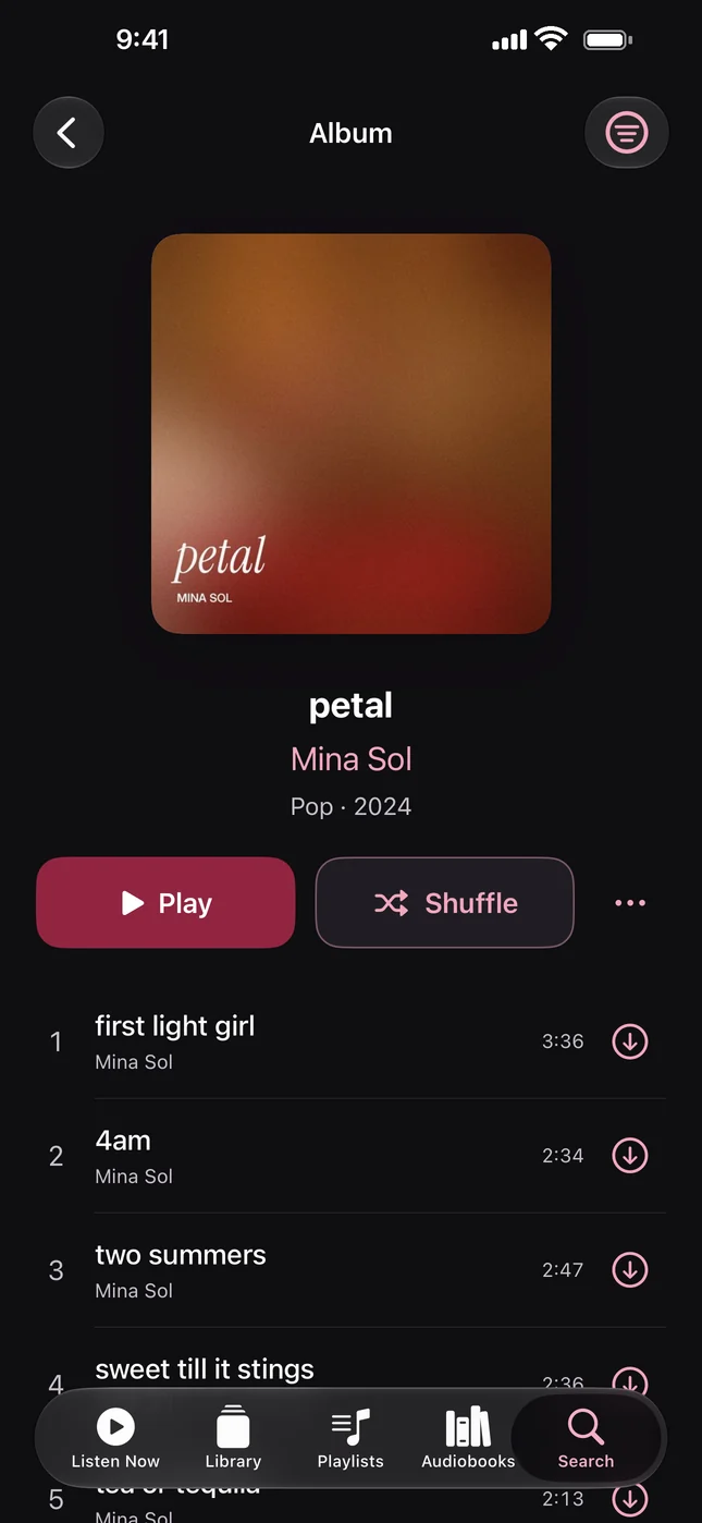 An album page with Play, Shuffle and the track list.